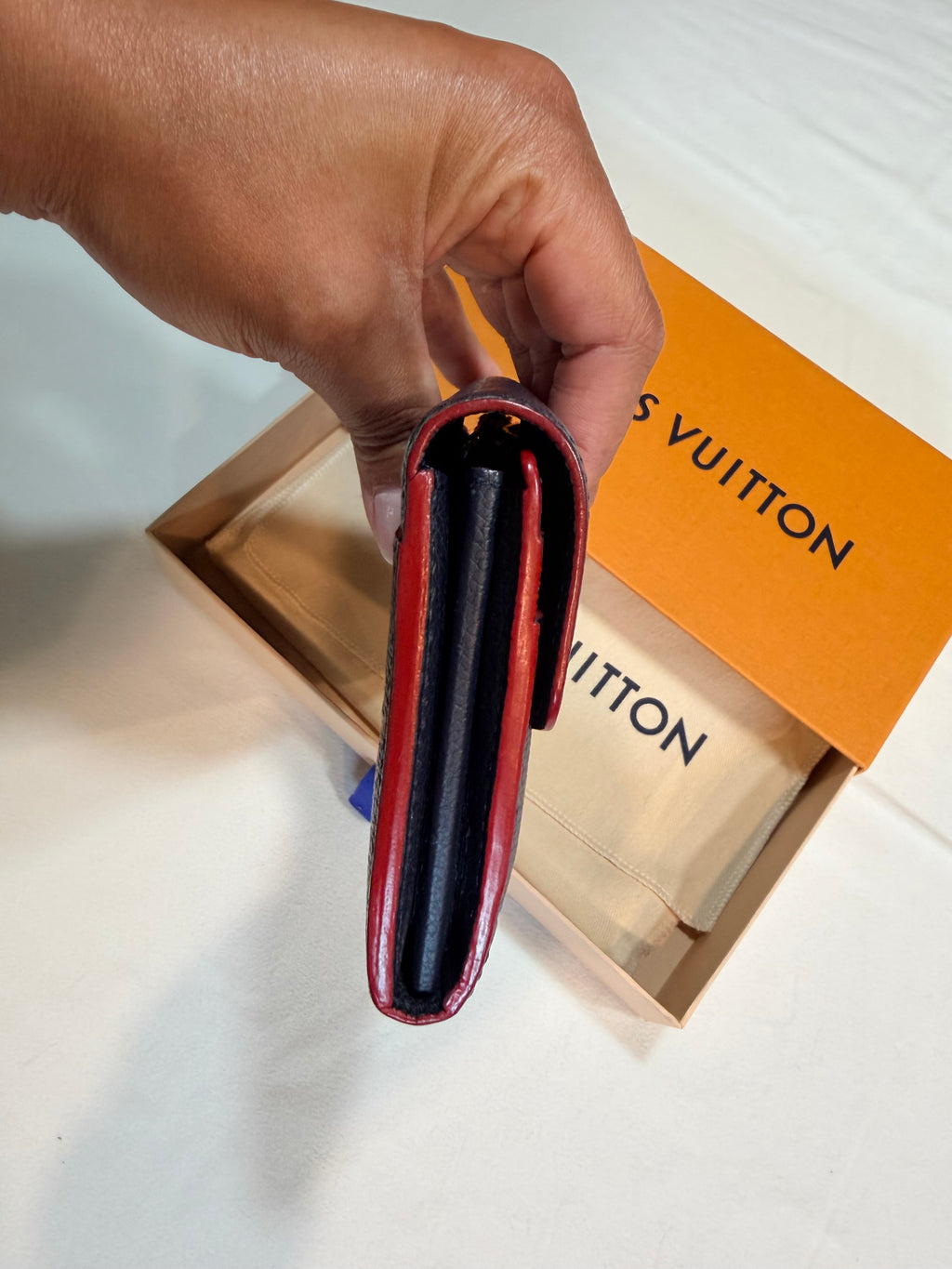 Louis Vuitton Sarah Wallet in Empreinte leather navy/red 42