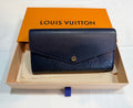 Louis Vuitton Sarah Wallet in Empreinte leather navy/red 42